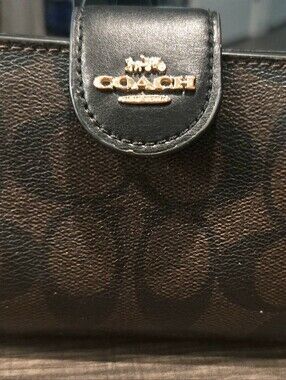 Coach Black Signature Leather Trifold Wallet with Gold Logo. Used Good Condition